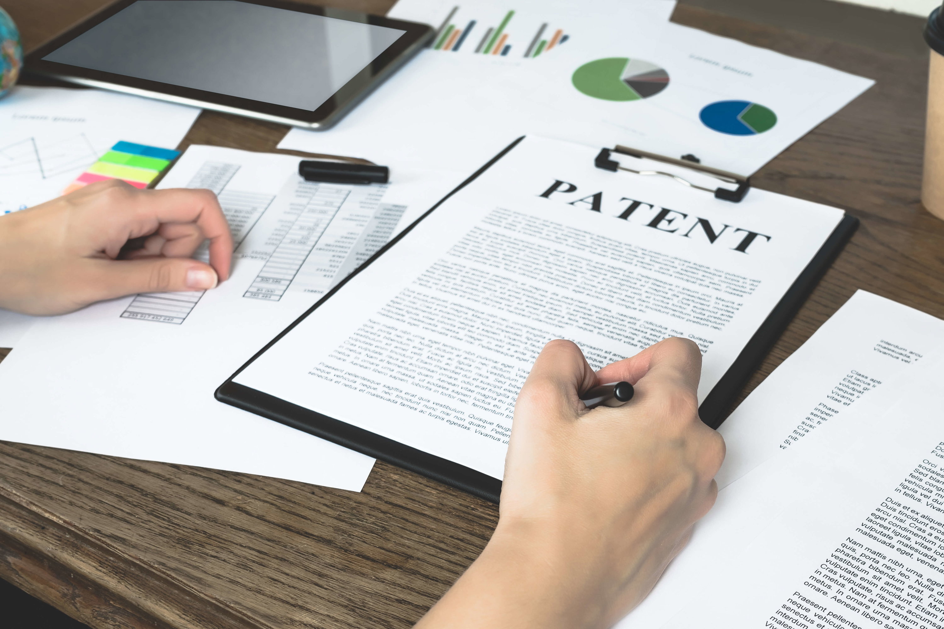  business-woman-signs-patent-intellectual-property-protection-concept.jpg